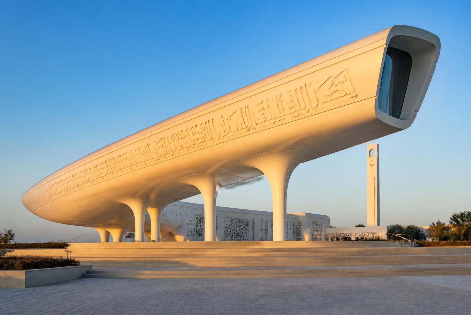 Education City Mosque in Doha, Qatar — its elevated prayer hall carved with Arabic calligraphy and supported on five columns