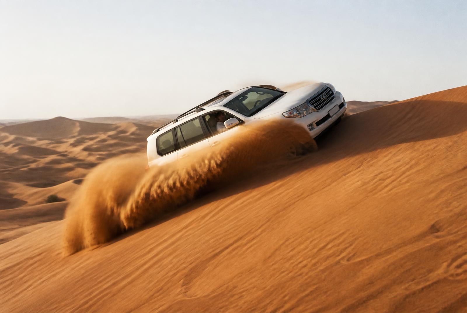 4x4 dune bashing across the high dunes of the Qatari desert